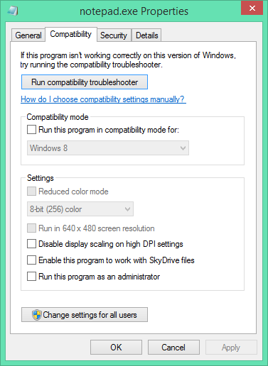 Screenshot of Notepad.exe and the Compatibility property sheet